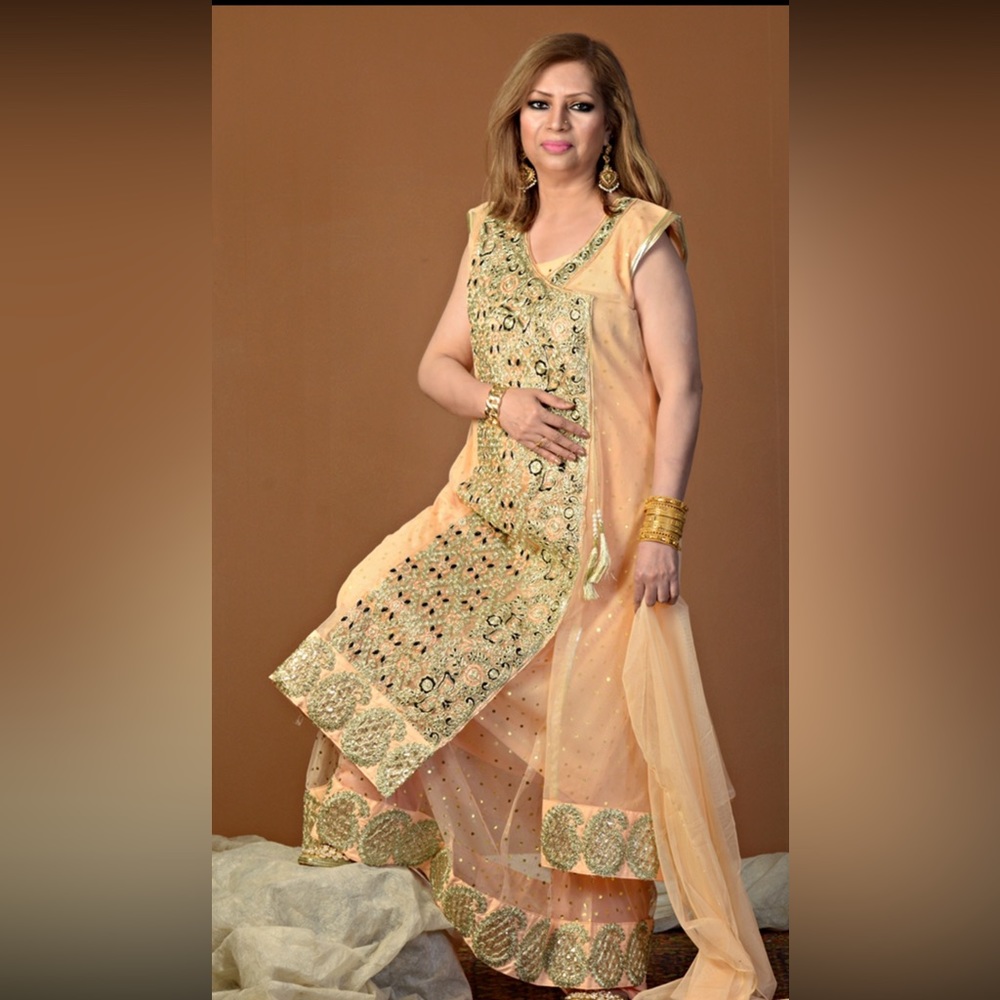 Very pretty peach color net long dress with bottom